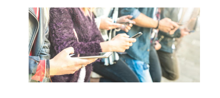 Diverse group texting, always on mobile devices for SMS marketing