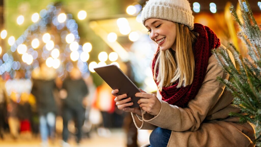 After seeing successful holiday marketing campaigns, a happy shopper looks forward to shopping.