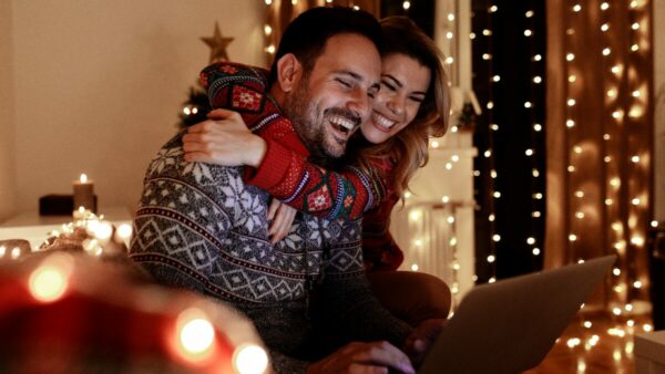 Happy people watching the best Christmas ads 2024.